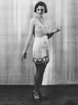 A woman displaying a 1920s girdle. 