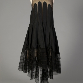 American, ca. 1920. Black thin faille silk with black net, panels of silk applied from bust.
